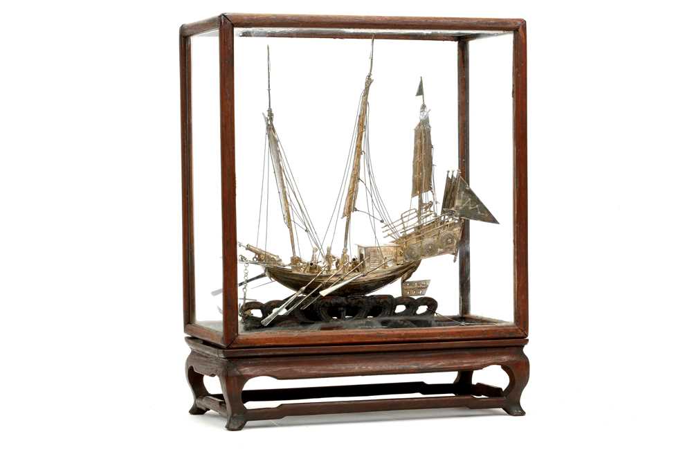 Lot 83 - A CHINESE EXPORT SILVER MODEL OF A BOAT. Circa...