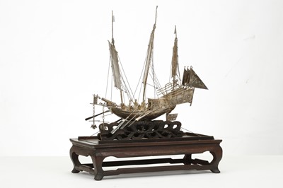 Lot 83 - A CHINESE EXPORT SILVER MODEL OF A BOAT. Circa...