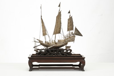 Lot 83 - A CHINESE EXPORT SILVER MODEL OF A BOAT. Circa...