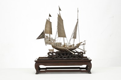 Lot 83 - A CHINESE EXPORT SILVER MODEL OF A BOAT. Circa...