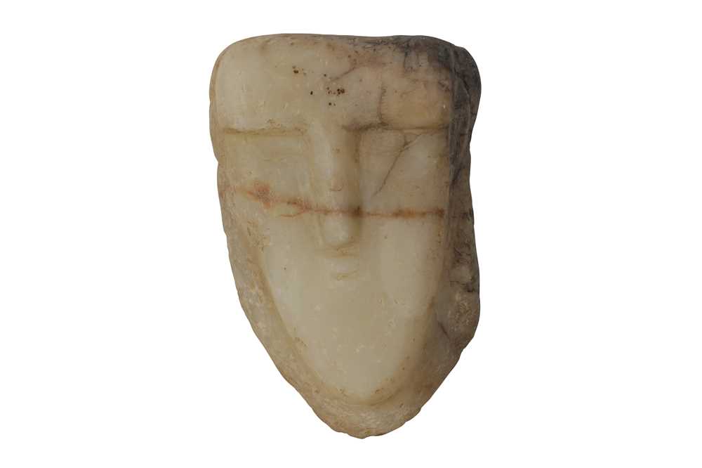 Lot 5 - A SOUTH ARABIAN ALABASTER HEAD OF A MAN, CIRCA 1ST CENTURY B.C.- 1ST CENTURY A.D.