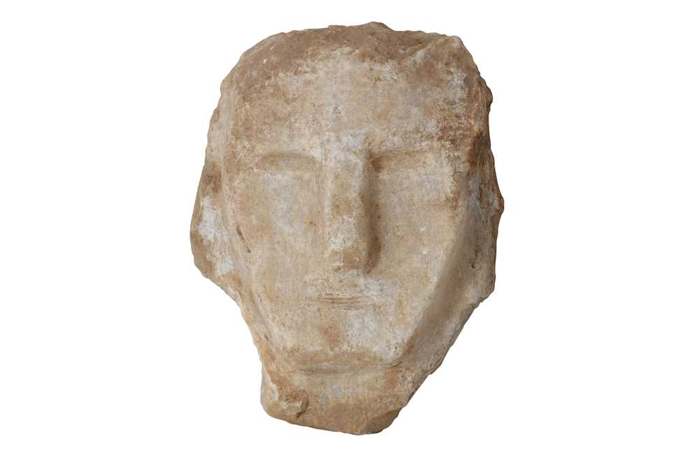 Lot 8 - A SOUTH ARABIAN ALABASTER HEAD OF A MAN, CIRCA 1ST CENTURY B.C.- 1ST CENTURY A.D.