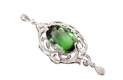 Lot 1234 - A green tourmaline and diamond pendant