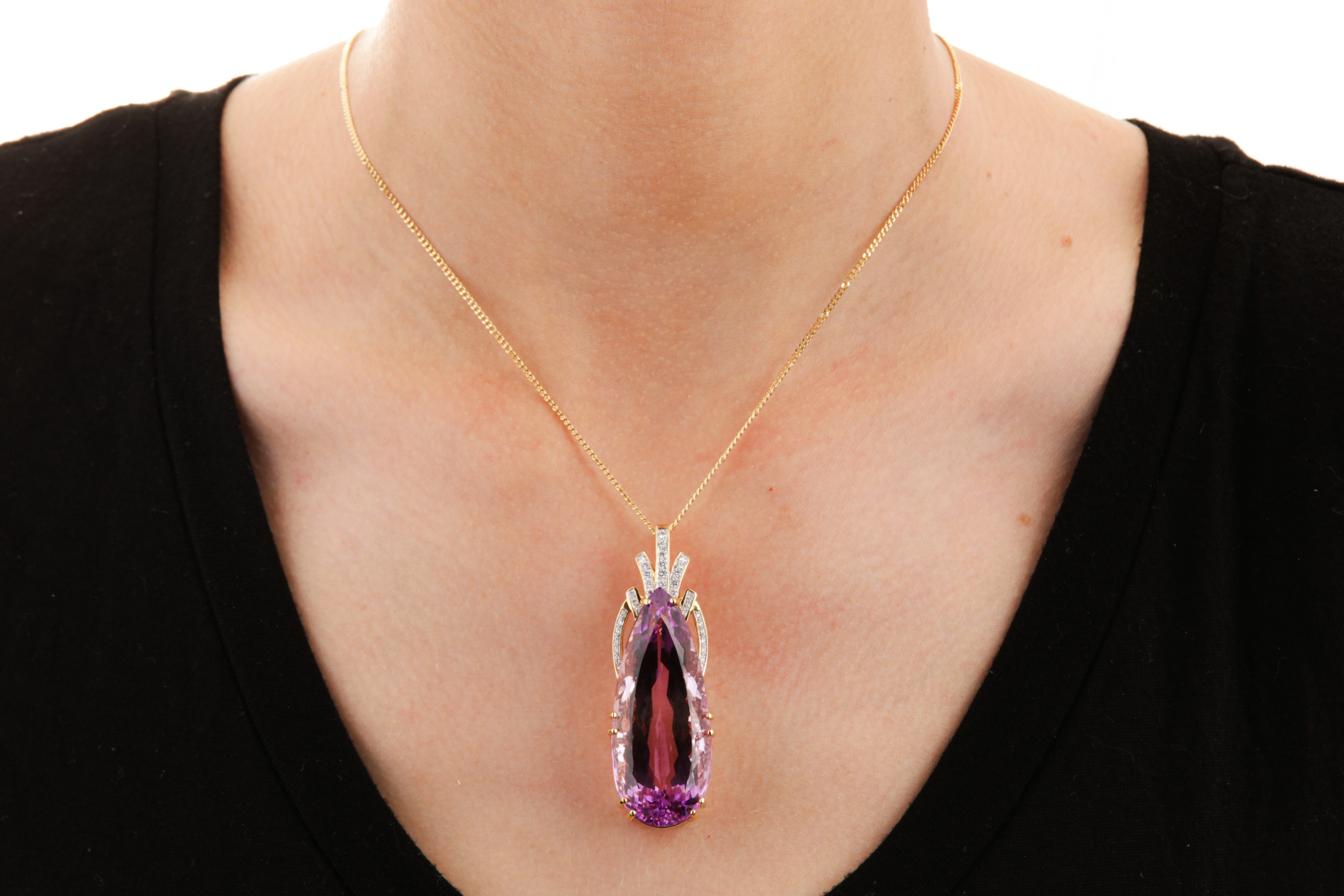 Lot 110 A kunzite and diamond pendant necklace