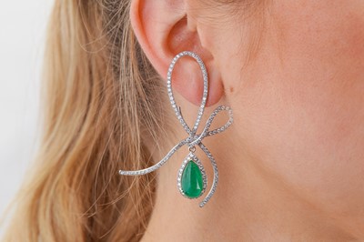Lot 1231 - A pair of emerald and diamond earrings