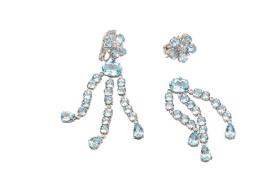 Lot 87 - A pair of blue topaz and diamond pendent earrings