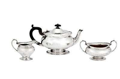 Lot 338 - A George V sterling silver three-piece tea service, London 1923 by Josiah Williams & Co