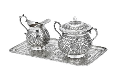 Lot 222 - A mid – 20th century Iranian (Persian) silver sugar and cream set on tray, Isfahan circa 1972 mark of Rabii, retailed by Pirayesh