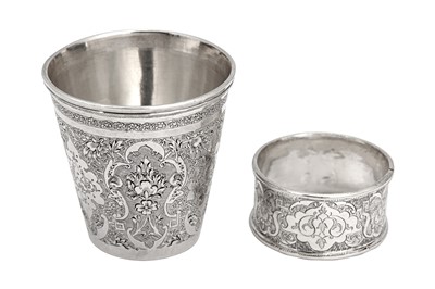 Lot 213 - A mid-20th century Iranian (Persian) silver christening set, Isfahan circa 1950, the beaker with mark of Rasool Parvaresh