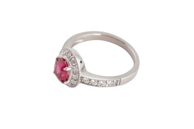 Lot 114 - A ruby and diamond cluster ring