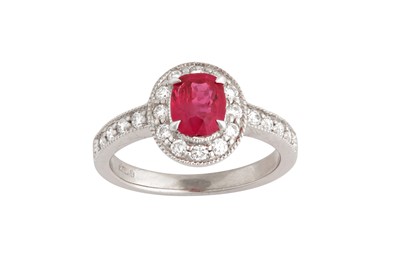 Lot 114 - A ruby and diamond cluster ring