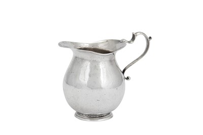 Lot 413 - A George II Channel Islands silver cream jug, Guernsey circa 1740 by Guillaume Henry (active 1720-67)