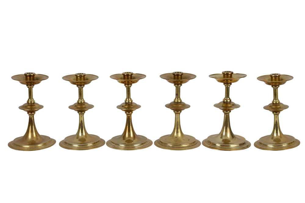 Lot 421 - A set of six 20th Century brass candlesticks in the Arts and Crafts style
