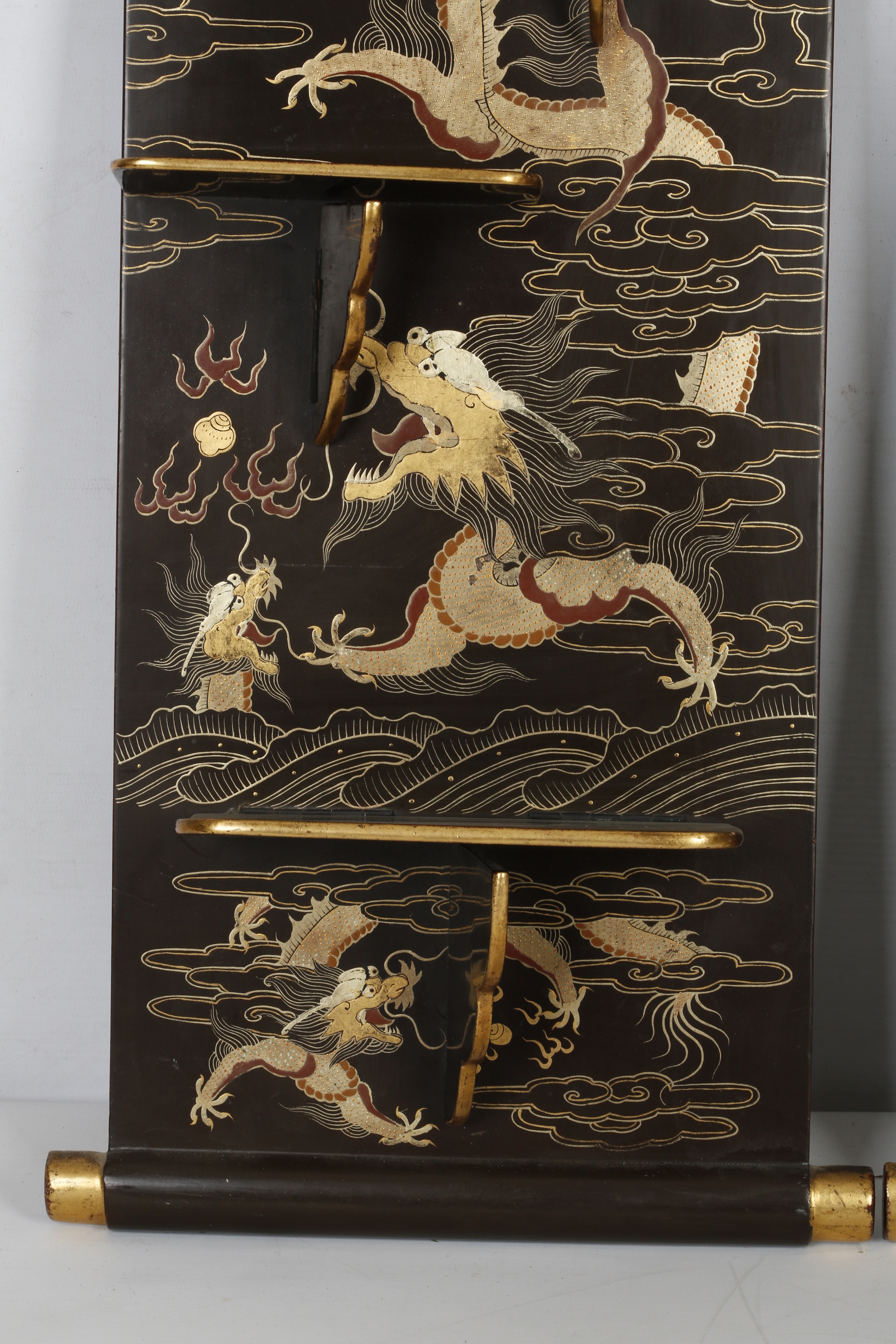 Lot 123 - A PAIR OF BLACK LACQUERED RECTANGULAR DRAGON