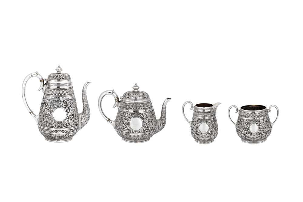 Lot 931 - A LARGE VICTORIAN INDIAN STYLE STERLING SILVER TEA AND COFFEE SERVICE