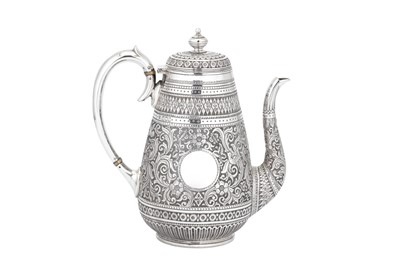 Lot 931 - A LARGE VICTORIAN INDIAN STYLE STERLING SILVER TEA AND COFFEE SERVICE