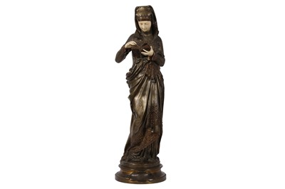 Lot 61 - AN EARLY 20TH PATINATED BRONZE AND CARVED IVORY FIGURE OF 'LA LISEUSE' AFTER A MODEL BY ALBERT-ERNEST CARRIER-BELLEUSE (FRENCH, 1824-1887)