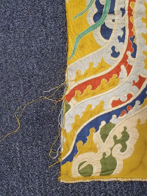 Lot 365 - A LARGE CHINESE YELLOW-GROUND 'DRAGON AND PHOENIX' TEXTILE.