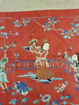 Lot 379 - A CHINESE EMBROIDERED RED-GROUND 'BOYS' TEXTILE PANEL.