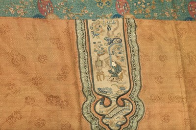 Lot 363 - A CHINESE RED-GROUND TEXTILE PANEL.
