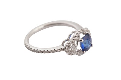 Lot 1256 - A sapphire and diamond ring