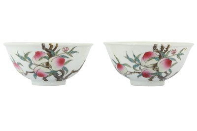 Lot 570 - A PAIR OF CHINESE FAMILLE ROSE 'BATS AND PEACHES' BOWLS.