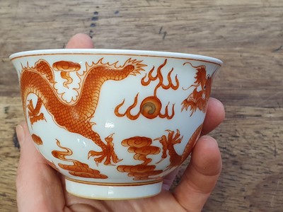 Lot 623 - A CHINESE IRON RED 'DRAGON' CUP.