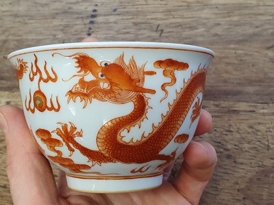 Lot 623 - A CHINESE IRON RED 'DRAGON' CUP.