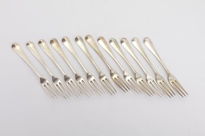 Lot 302 - A set of twelve Victorian sterling silver three pronged table forks, London 1872/73 by George Adams of Chawner and Co