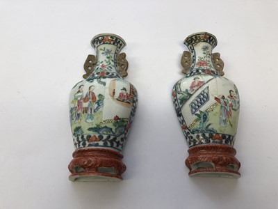 Lot 571 - A PAIR OF CHINESE FAMILLE ROSE WALL VASES.