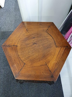 Lot 49 - A CHINESE HEXAGONAL CARVED WOOD STAND.