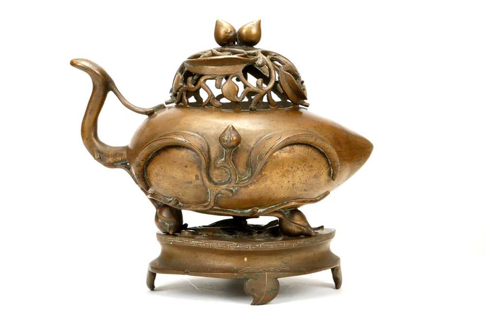 Lot 175 - A CHINESE BRONZE PEACH FORM CENSER AND COVER...