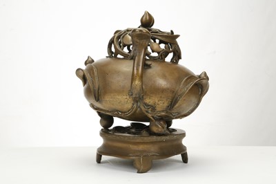 Lot 175 - A CHINESE BRONZE PEACH FORM CENSER AND COVER...