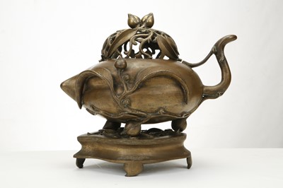 Lot 175 - A CHINESE BRONZE PEACH FORM CENSER AND COVER...