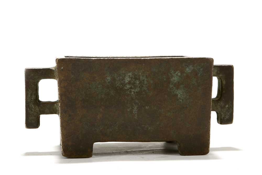 Lot 176 - A CHINESE BRONZE RECTANGULAR CENSER. Resting
