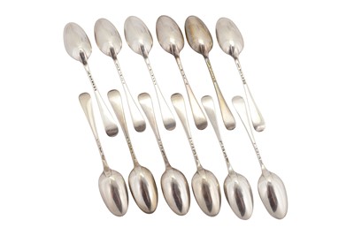 Lot 305 - A matched set of twelve George III sterling silver dessert spoons, eleven London 1761 by William Chatteron (reg. 7 June 1762, Grimwade 3060)