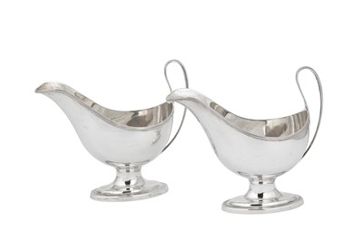 Lot 346 - A pair of George V sterling silver sauce boats, London 1925 by Goldsmiths and Silversmiths