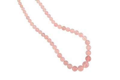 Lot 1214 - A rose quartz necklace and ring