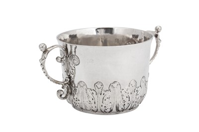 Lot 475 - A Charles II sterling silver porringer, London 1682 by Thomas Cooper (free 1668. d. c. 1693)