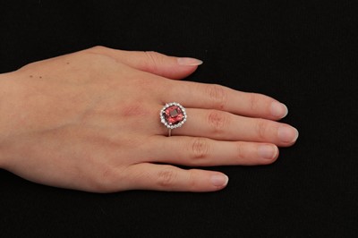 Lot 117 - A pink tourmaline and diamond cluster ring