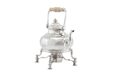 Lot 472 - A Queen Anne Britannia standard silver kettle on burner stand, London 1713 by Augustine Courtauld (reg. 23 Dec 1708)