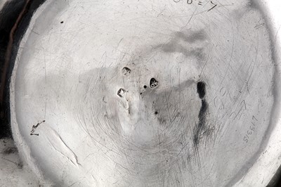 Lot 472 - A Queen Anne Britannia standard silver kettle on burner stand, London 1713 by Augustine Courtauld (reg. 23 Dec 1708)