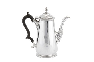 Lot 419 - A George II Irish sterling silver coffee pot, Dublin circa 1750 by William Williamson II (active 1734-70)