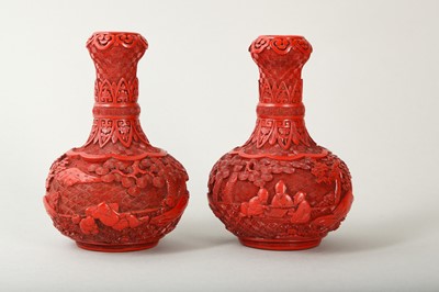 Lot 43 - A PAIR OF CHINESE CINNABAR LACQUER 'SCHOLARS' GARLIC MOUTH VASES.