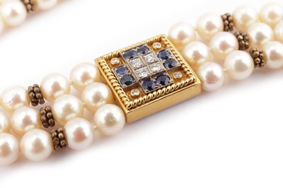 Lot 1266 - A cultured pearl, sapphire and diamond necklace
