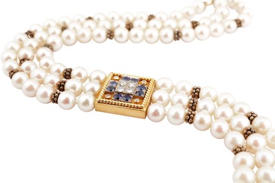 Lot 215 - A cultured pearl, sapphire and diamond necklace