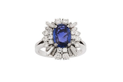 Lot 158 - A sapphire and diamond dress ring, circa 1965