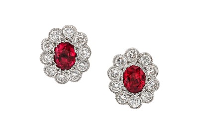 Lot 1206 - A pair of ruby and diamond earstuds