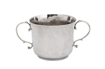 Lot 476 - A James II sterling silver porringer, London 1688 by YT two pellets above, fleur-de-lis below (unidentified)