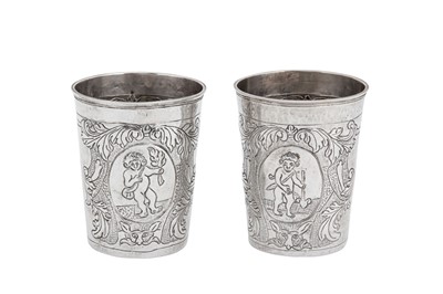Lot 166a - A pair of Elizabeth I mid-18th century Russian 84 zolotnik (875 standard) silver beakers, Moscow 1744 by Grigory Lakomkin (active 1736-69)